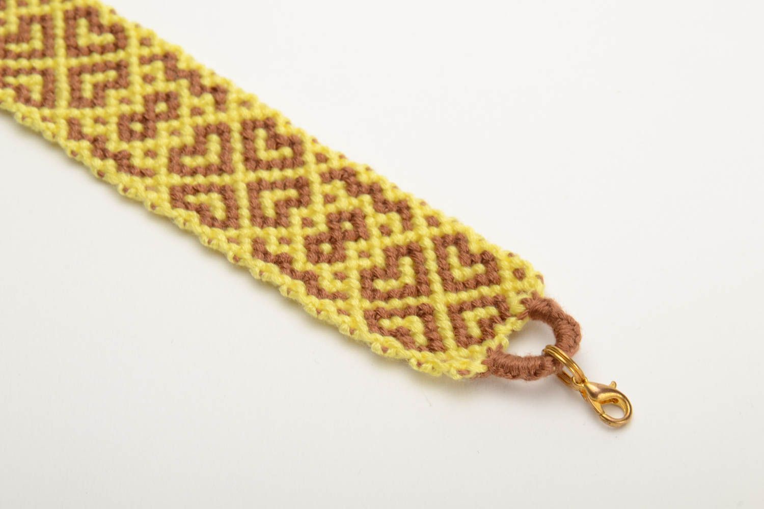 Handmade colored woven wide friendship bracelet made of floss threads yellow with beige photo 2