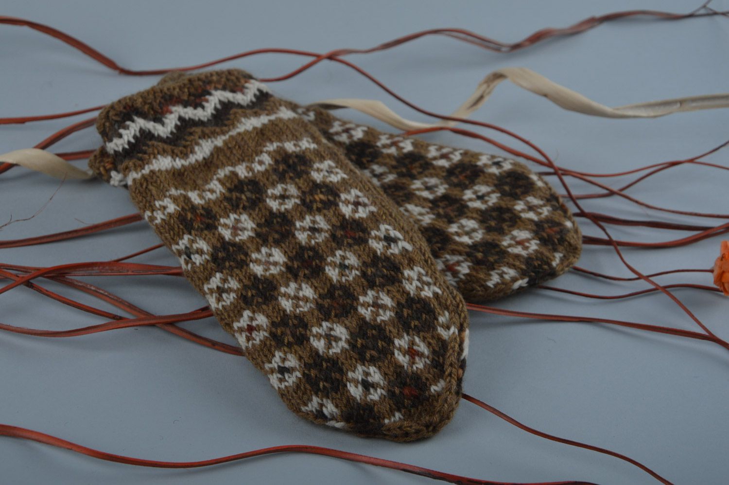 Handmade warm winter women's brown mittens knitted of wool with ornament photo 1