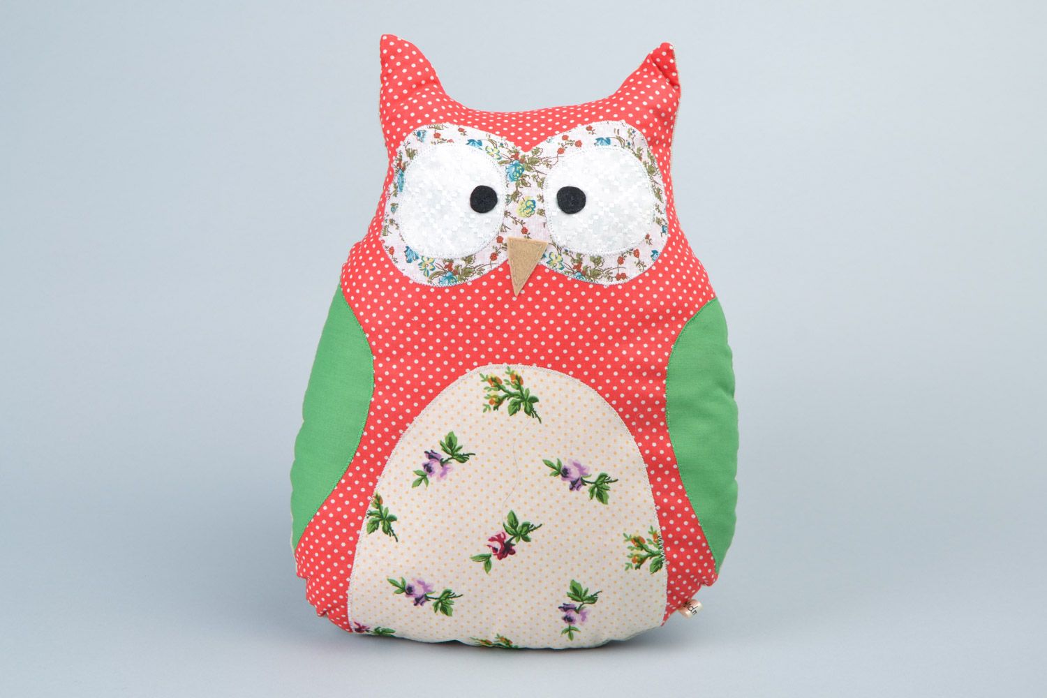 Handmade soft pillow pet sewn of cotton fabric in the shape of colorful owl photo 1
