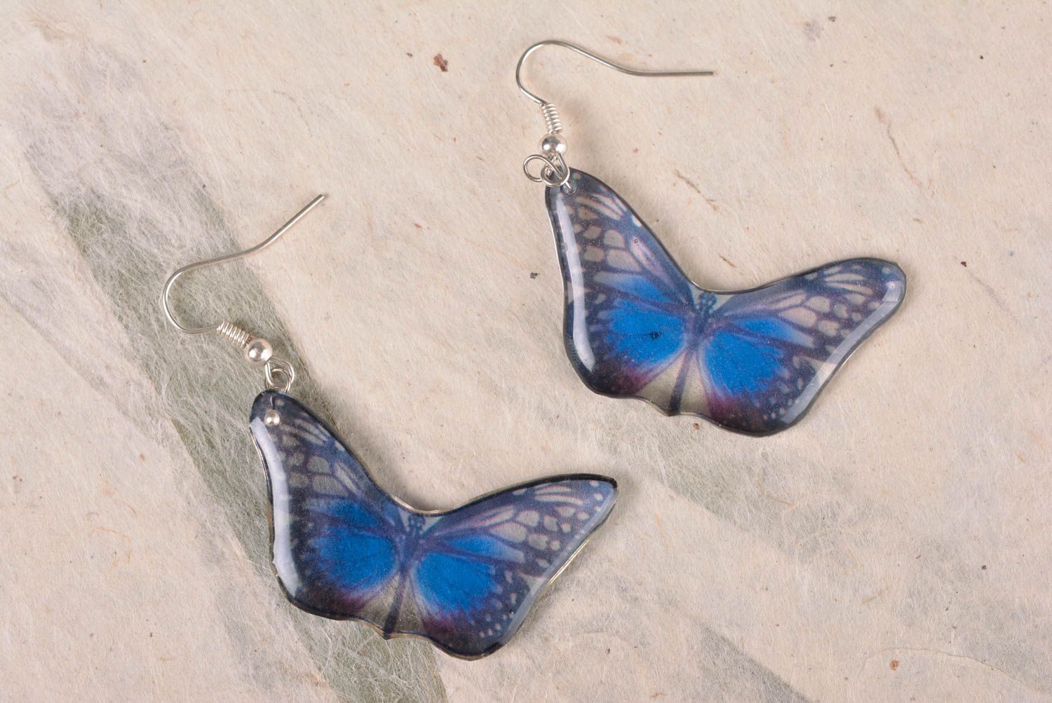 Handmade elegant designer dangling earrings blue butterflies in epoxy resin photo 1