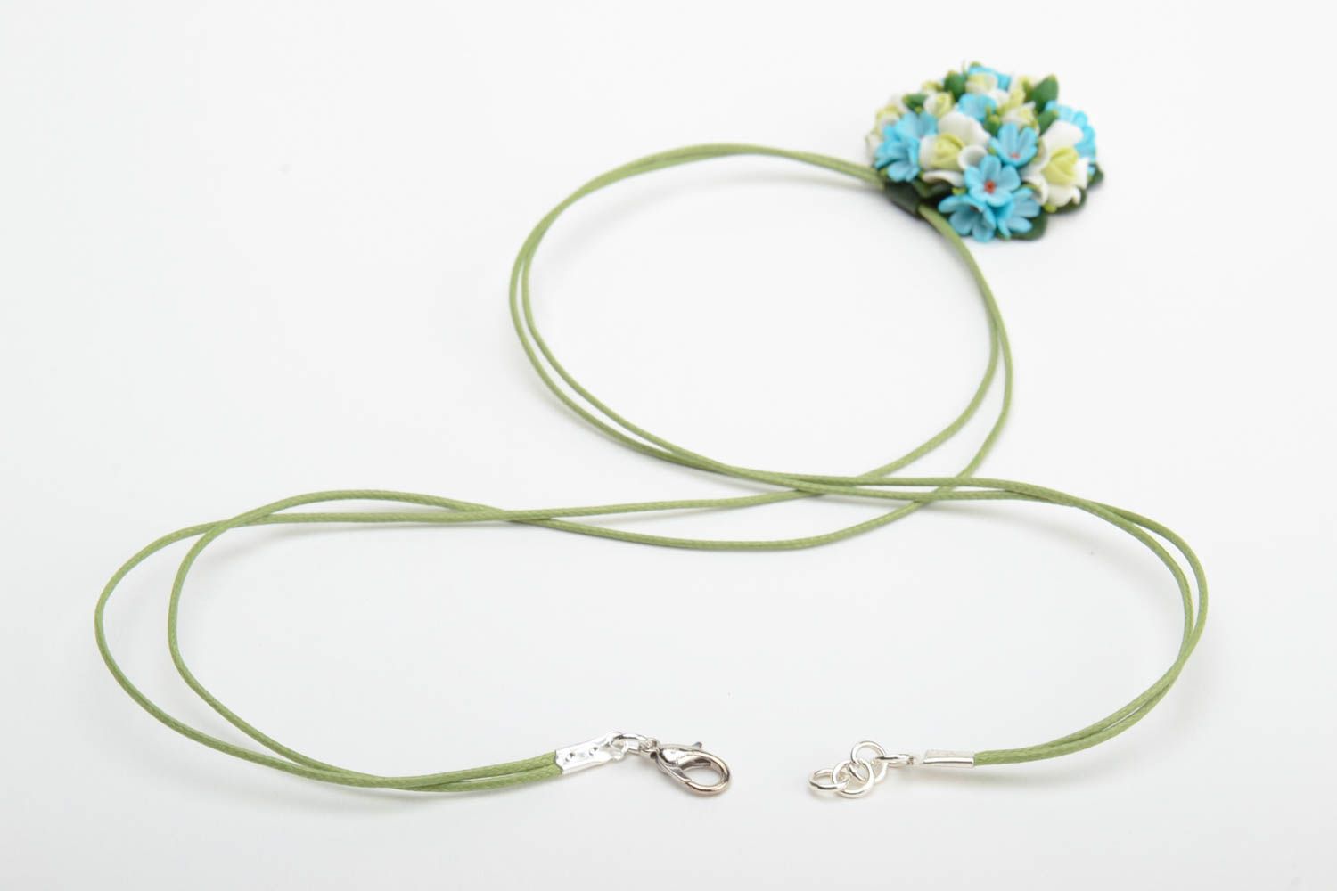 Handmade small round pendant necklace with blue polymer clay flowers on green cord photo 4