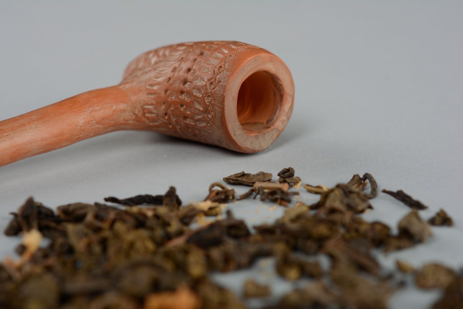 Red clay smoking pipe photo 2