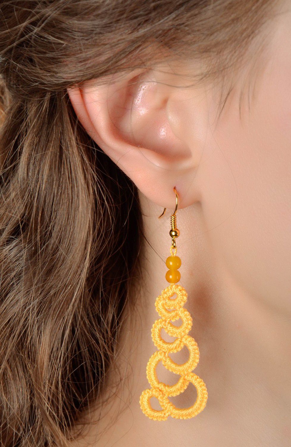 Orange earrings made from woven lace photo 4
