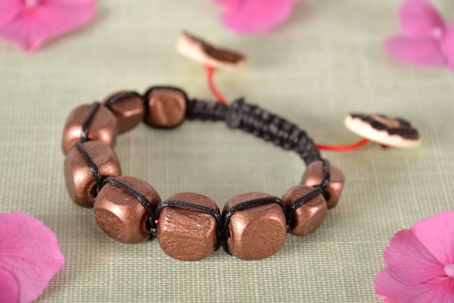Bracelet made of wooden beads and plastic buttons photo 2