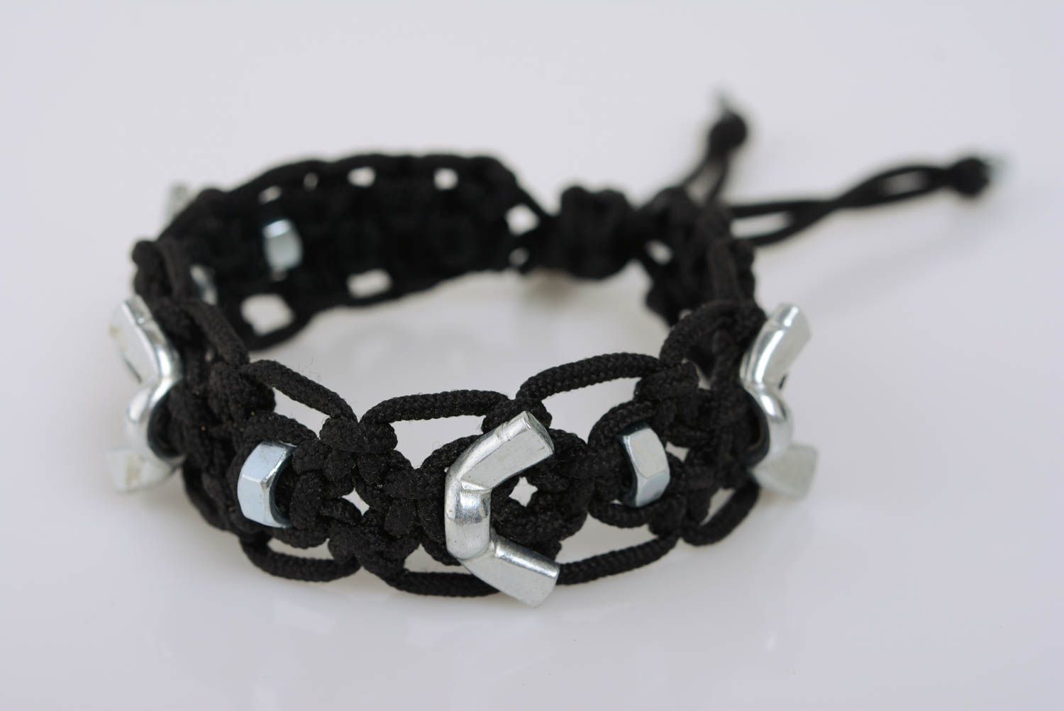Handmade black macrame woven cord bracelet with stainless steel nuts photo 1