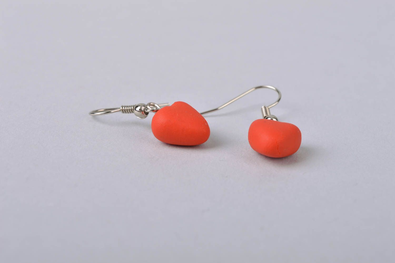 Handmade laconic romantic dangle earrings with small cold porcelain red hearts photo 4