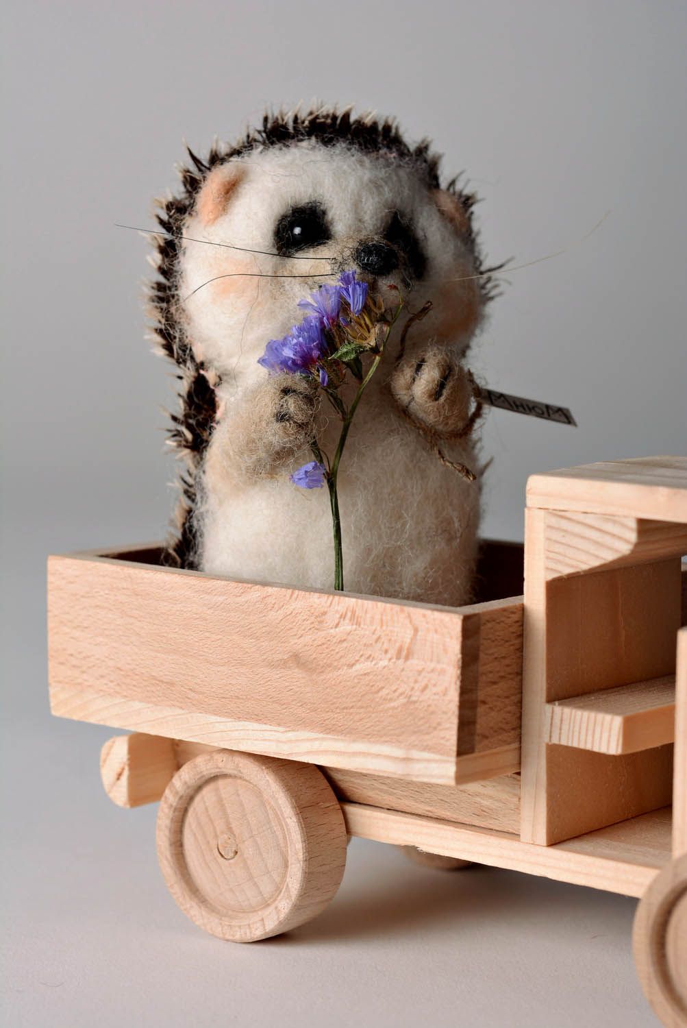 Toy made of felting wool Hedgehog with flower photo 3