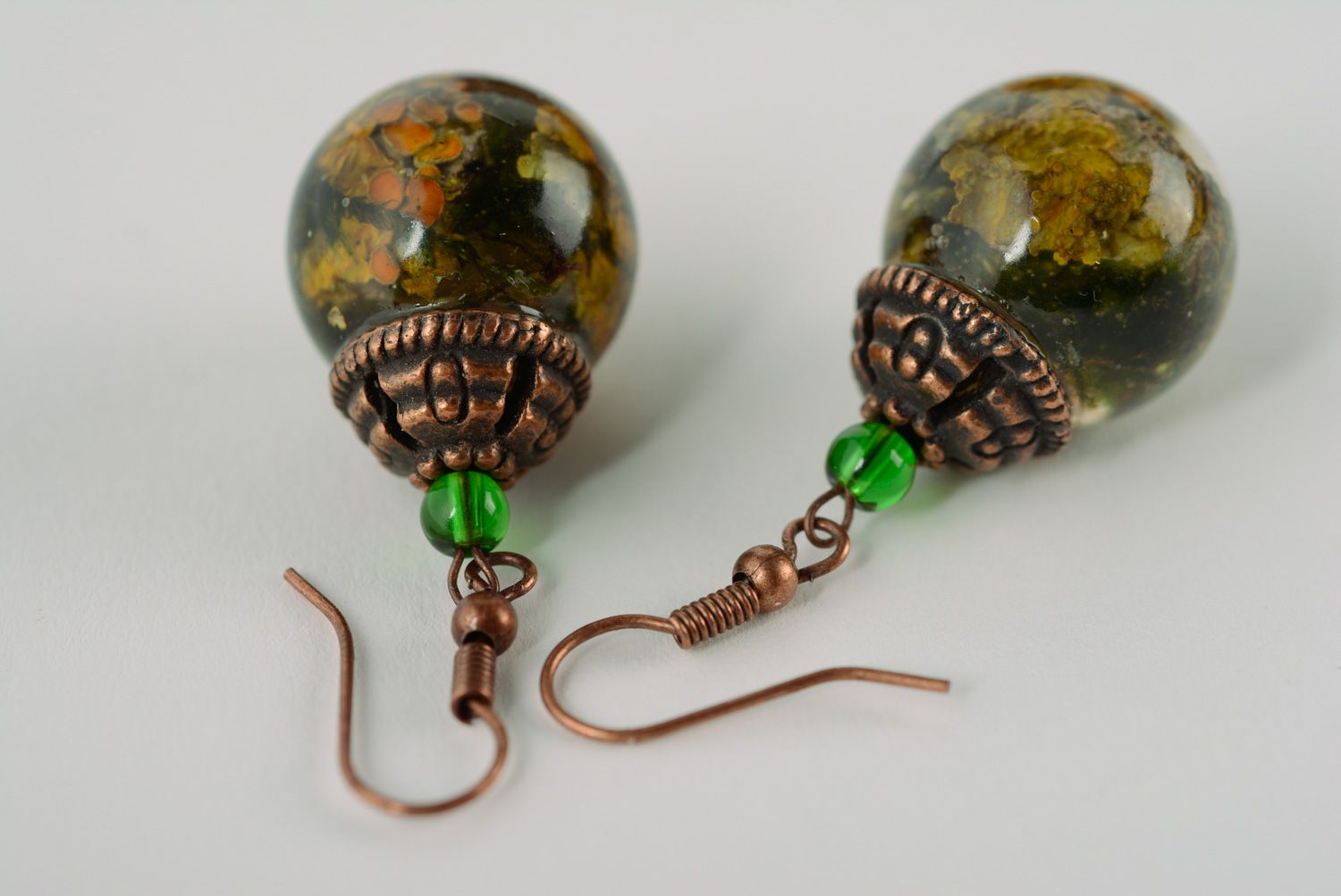 Handmade ball earrings with lichen plant coated with epoxy resin photo 3