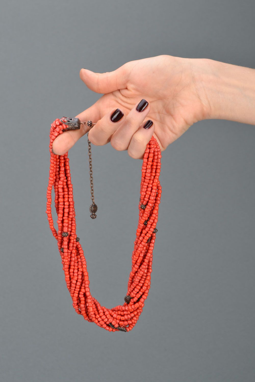 Beaded necklace of coral color photo 2