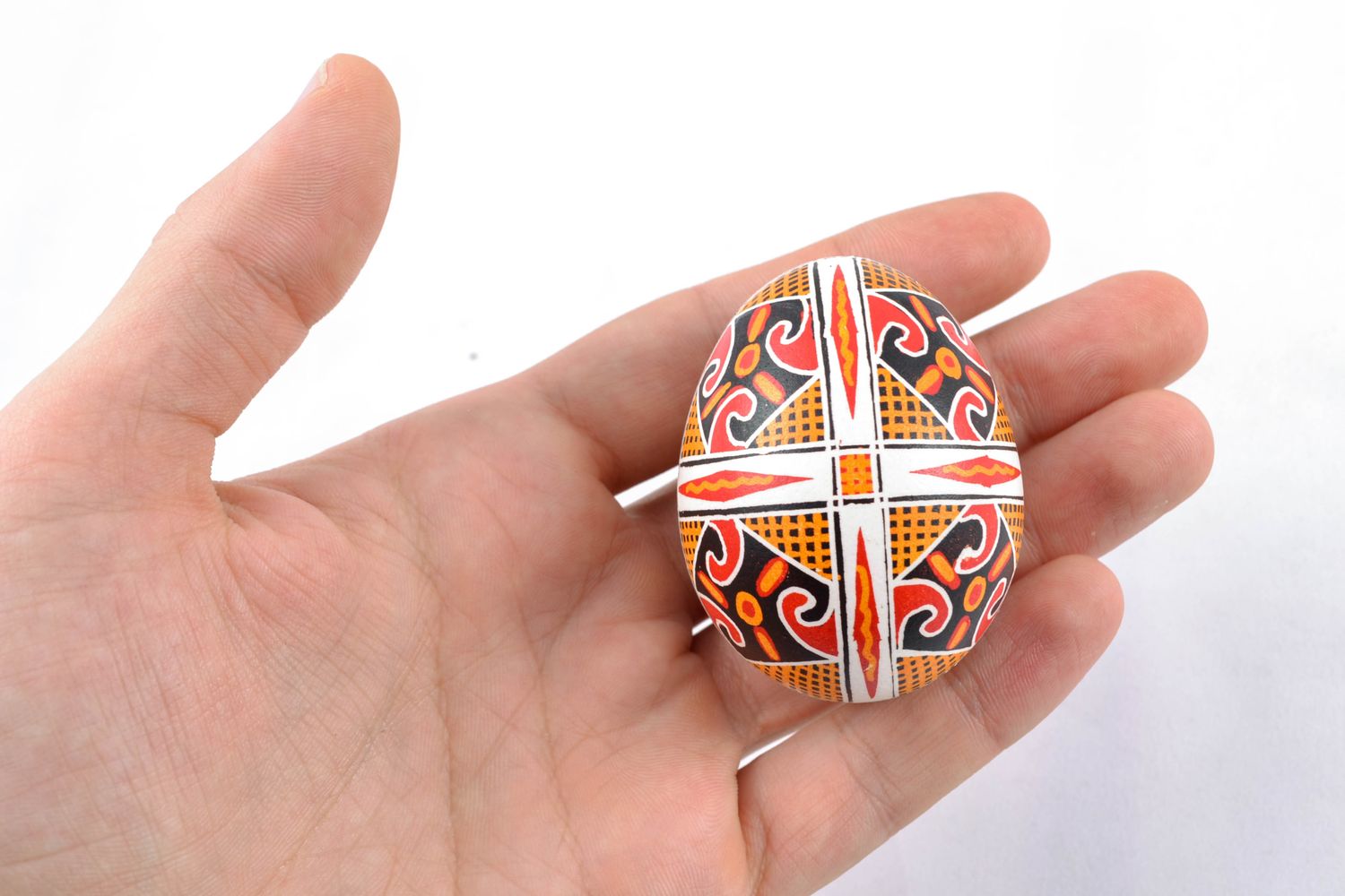Handmade Easter egg painted with solar symbols photo 2
