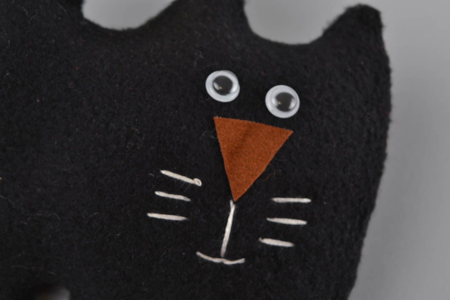 Handmade black soft toy cat made of fleece with colorful bow photo 4