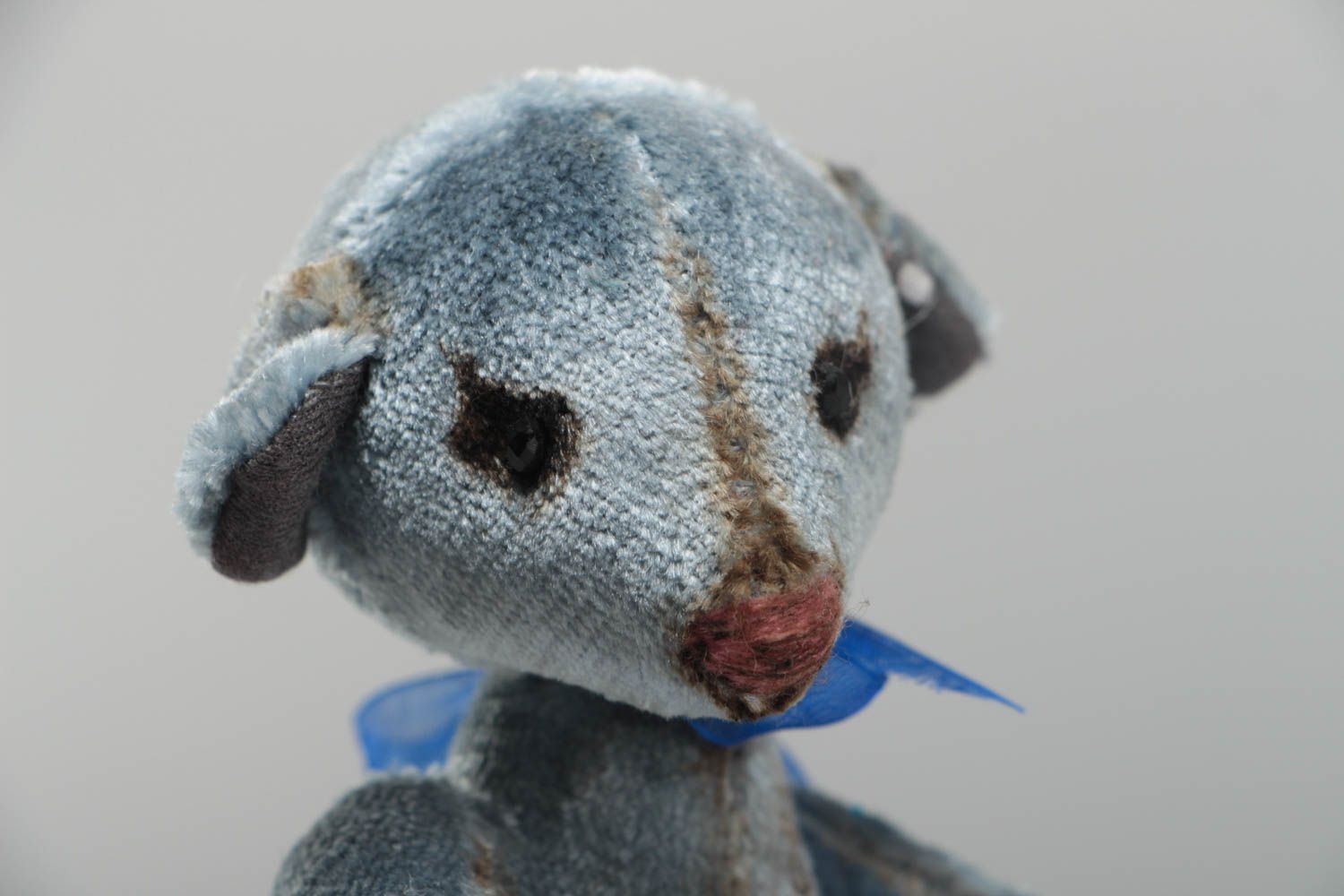 Handmade decorative gray toy bear with small bow interior decor element photo 3