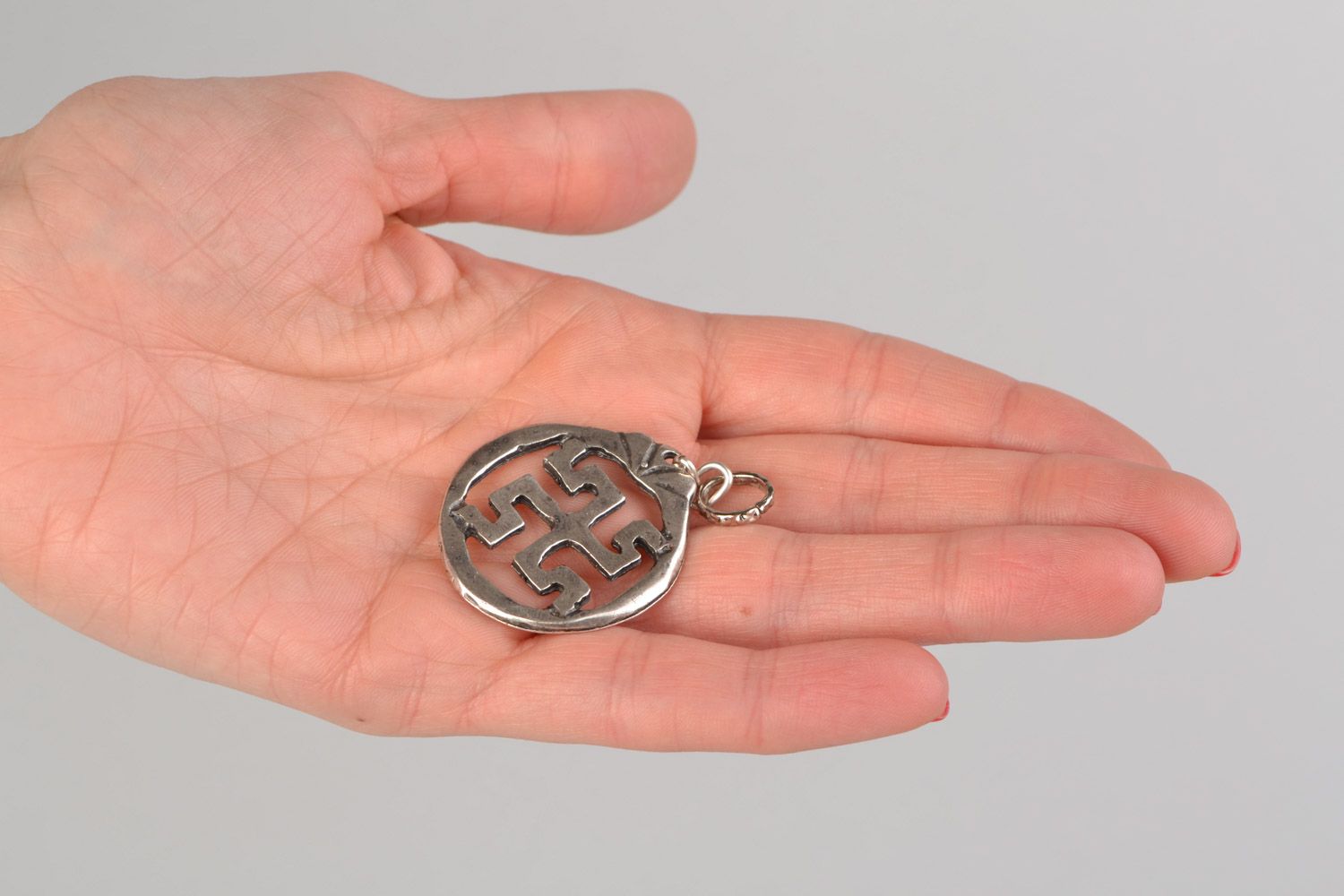 Handmade designer round metal pendant with Slavic symbol in ethnic style  photo 2