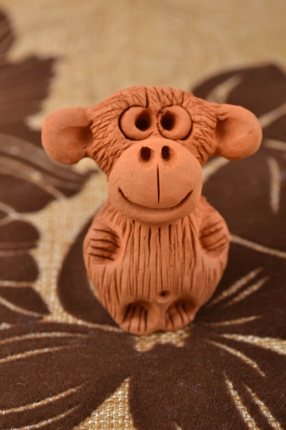 Small brown handmade designer molded red clay statuette of monkey photo 1