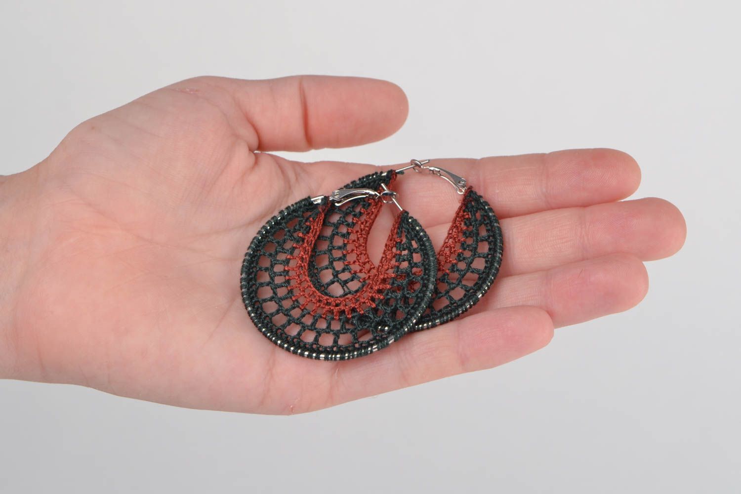 Handmade dangling ring shaped earrings woven of threads on metal round basis photo 2
