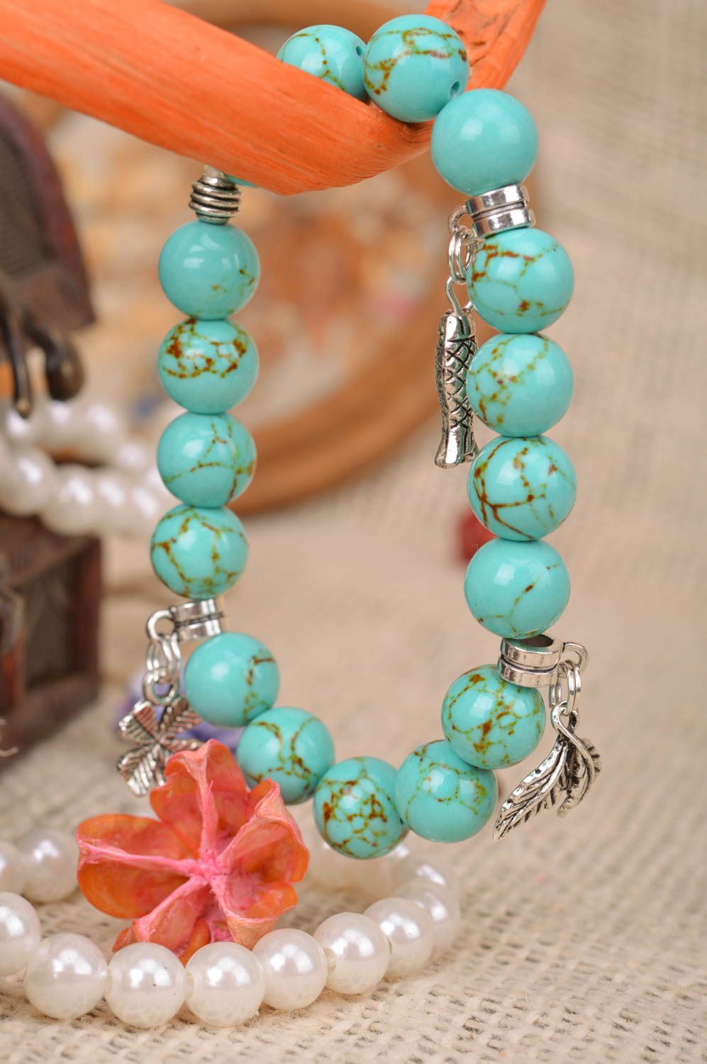 Handmade beaded wrist bracelet styled on turquoise with metal charms fish leaves photo 1