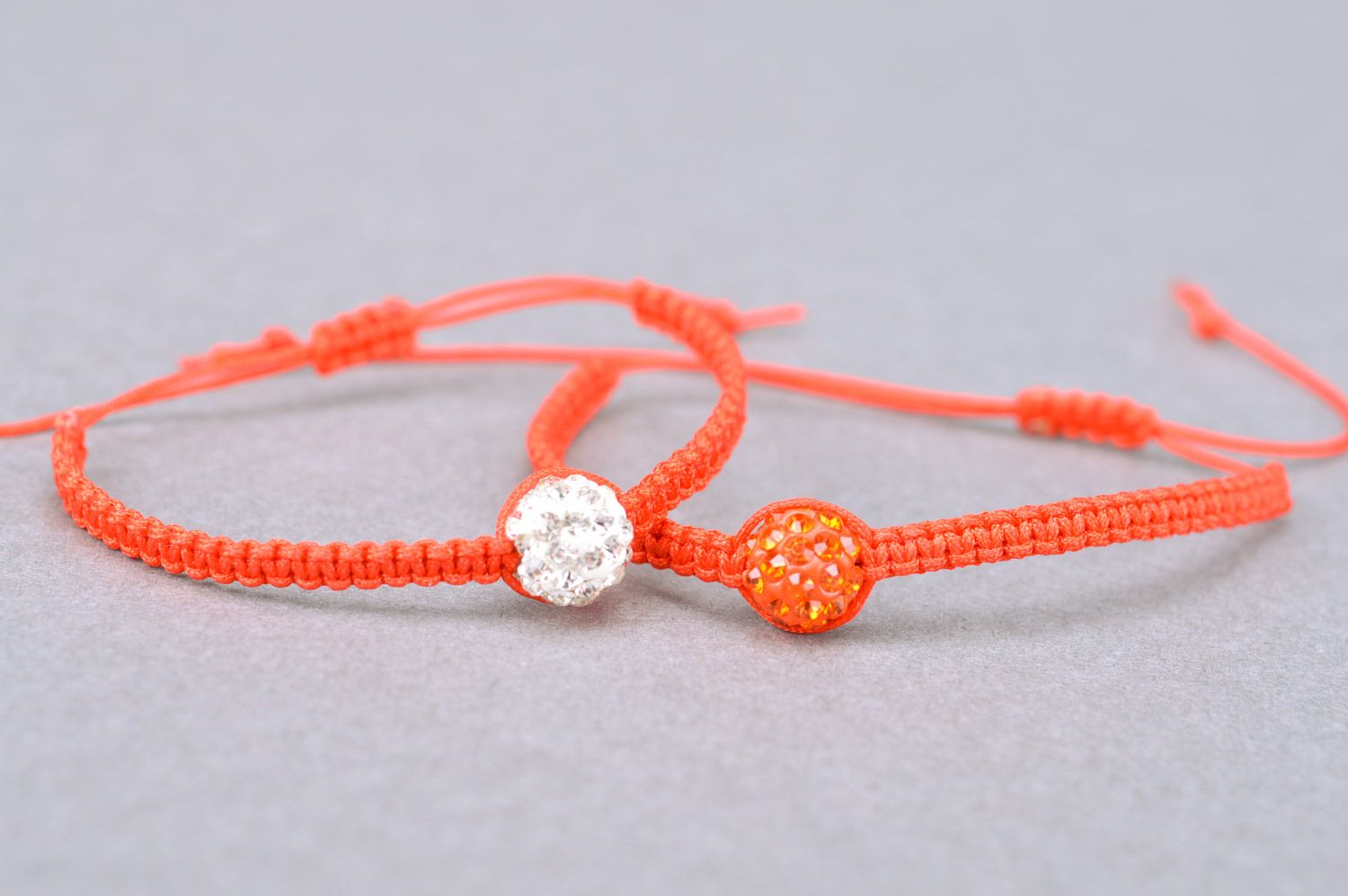 Set of 2 handmade orange friendship wrist bracelets woven of threads with beads  photo 2