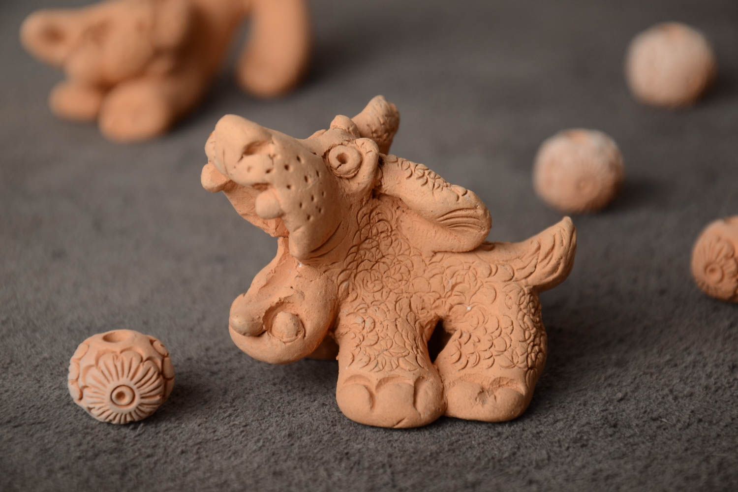 Beautiful beige handmade molded clay figurine of small barking dog photo 1