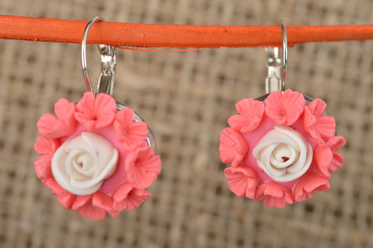 Polymer clay handmade pink earrings with charms in the shape of flowers photo 1