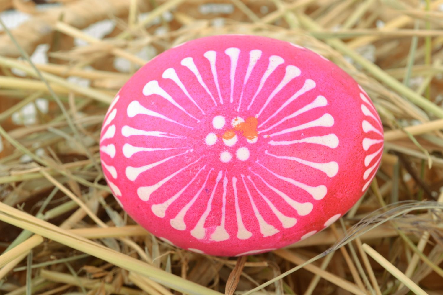 Bright pink Easter egg painted with melted wax and aniline dyes for home decor photo 1