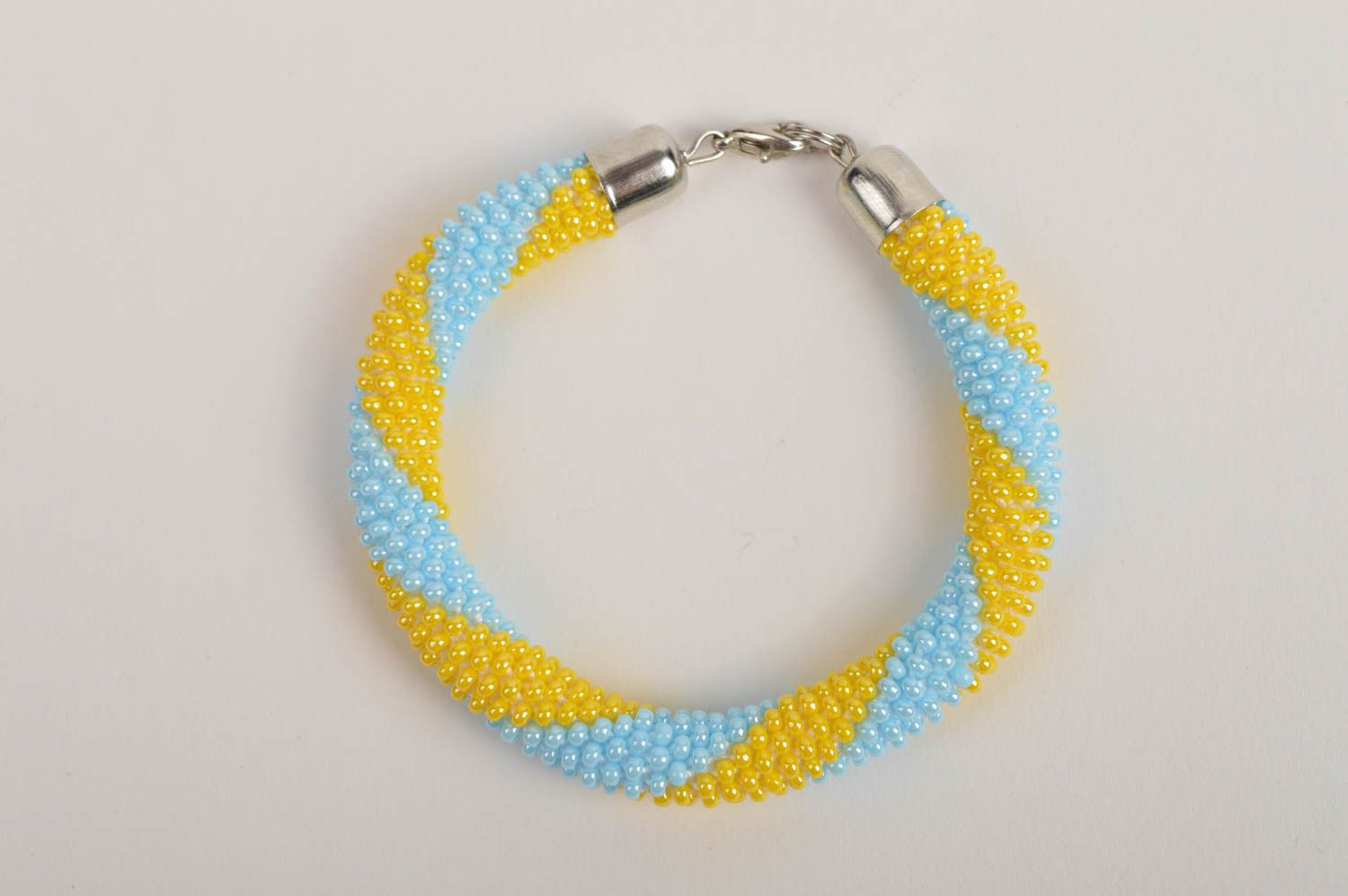 Homemade cord made of Czech beads adjustable bracelet in yellow and blue color photo 3