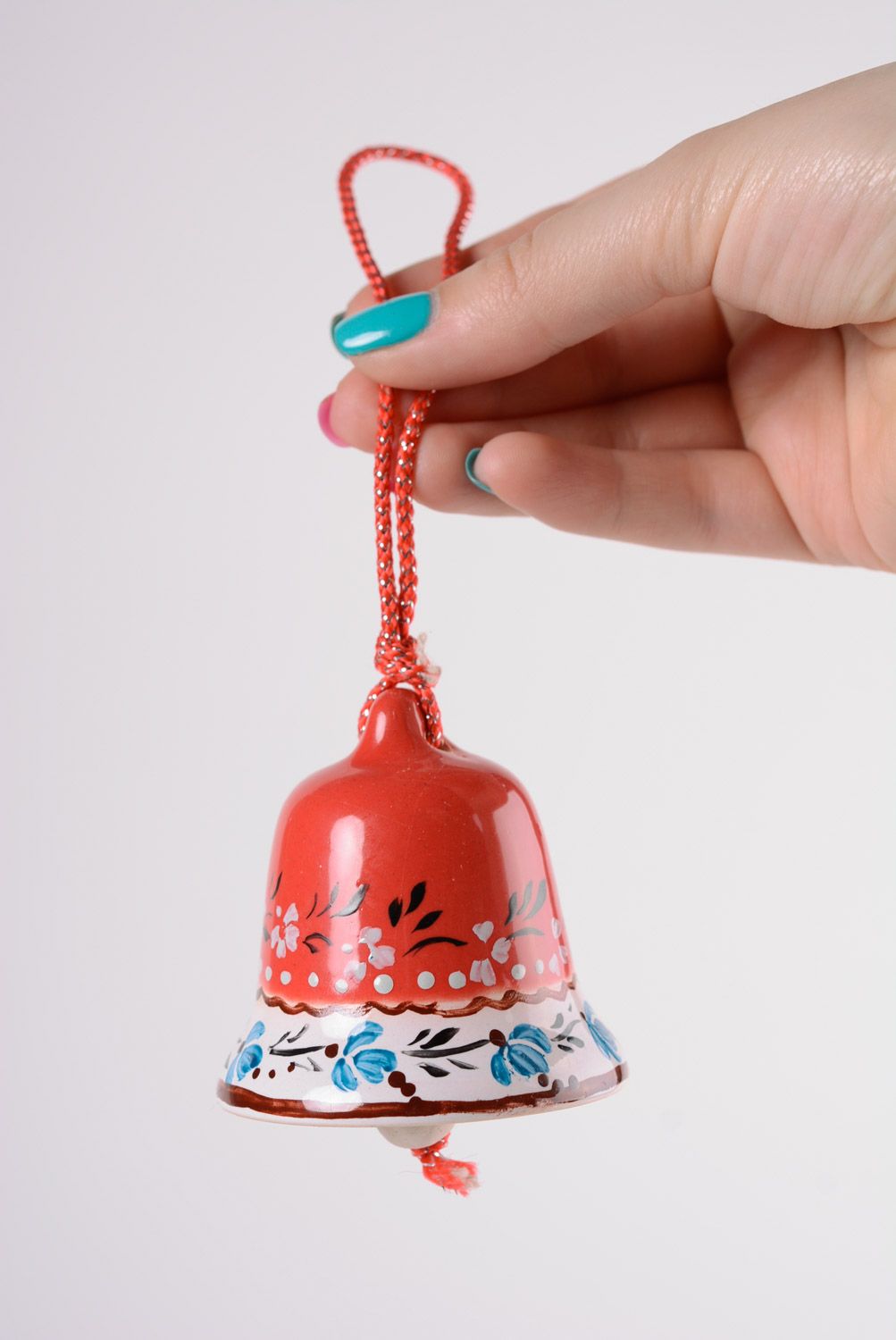 Small handmade maiolica ceramics decorative glazed red bell with blue ornament photo 2