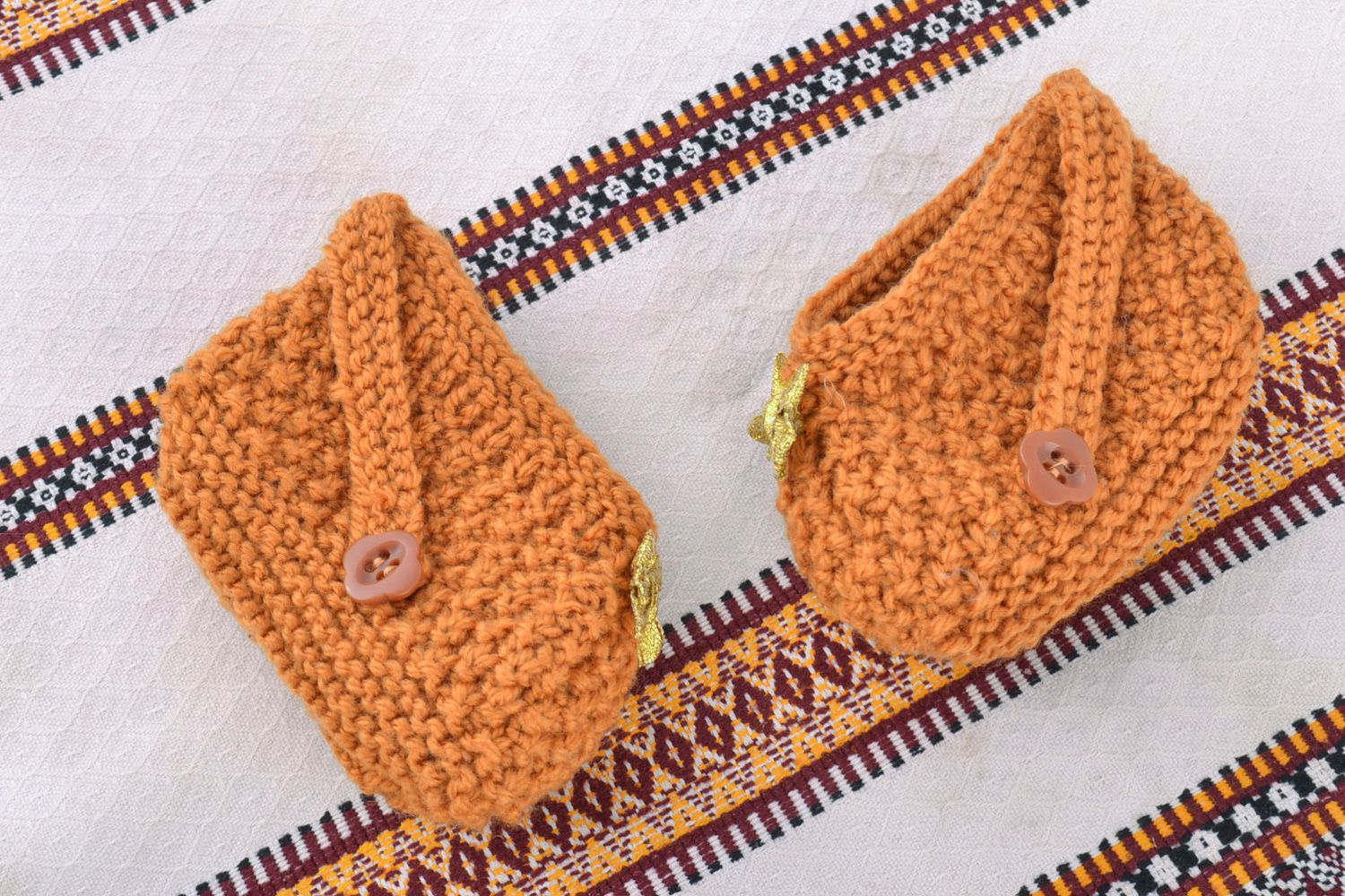 Handmade warm baby booties knitted of wool of light brown color for little girl photo 1