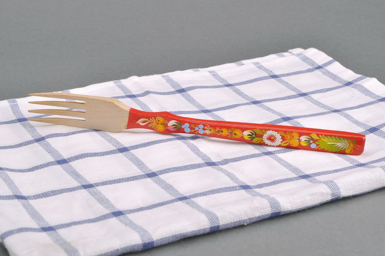 Wooden fork with red handle photo 1