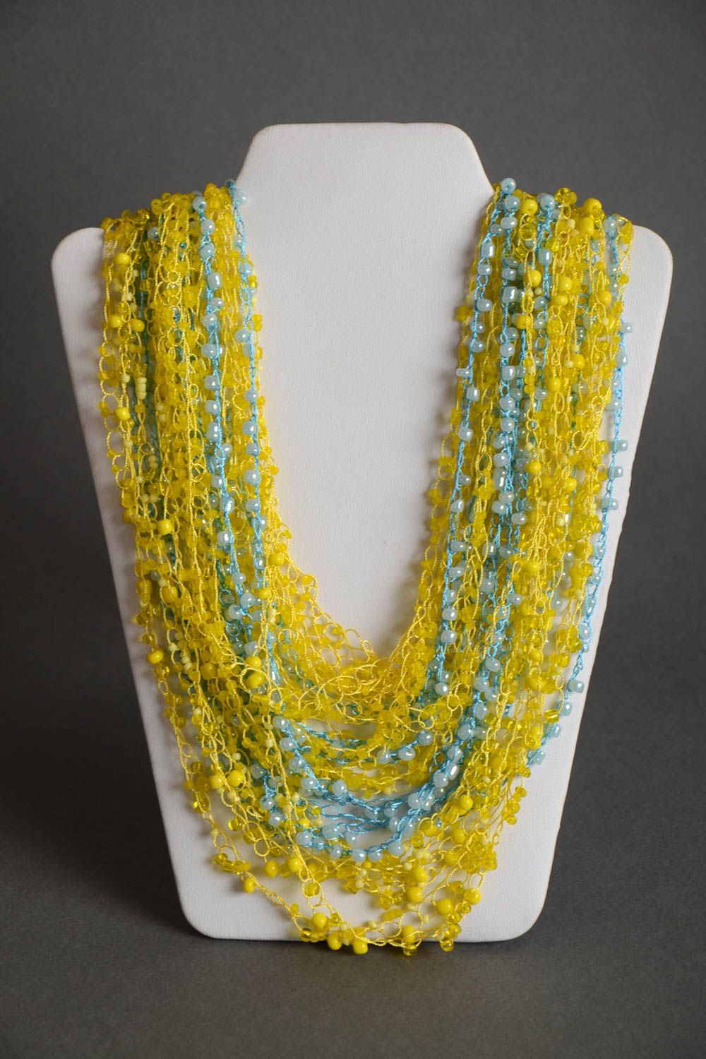Multirow long handmade airy woven beaded necklace of yellow color photo 2