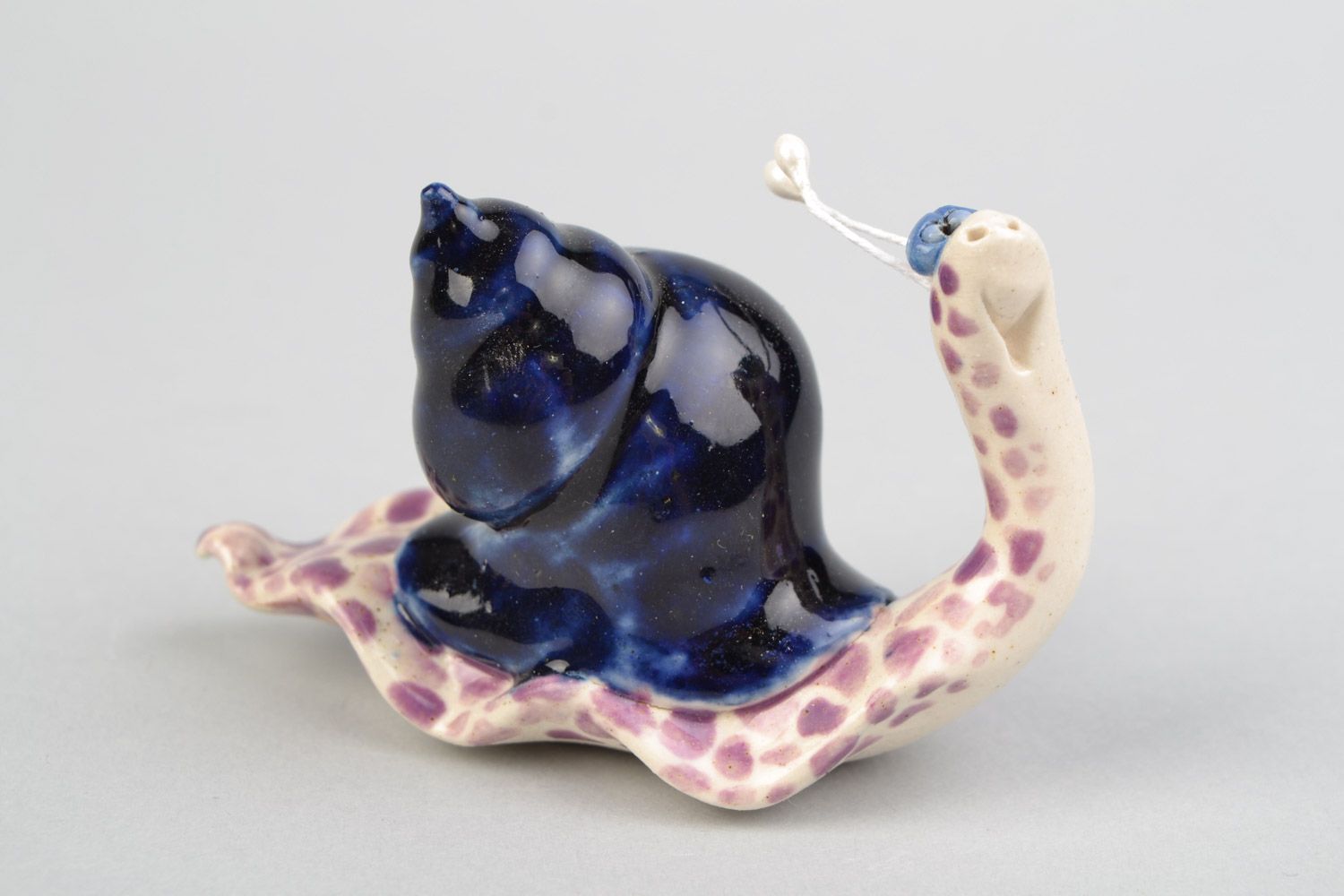 Handmade decorative ceramic snail figurine painted with colored glaze home decor photo 1