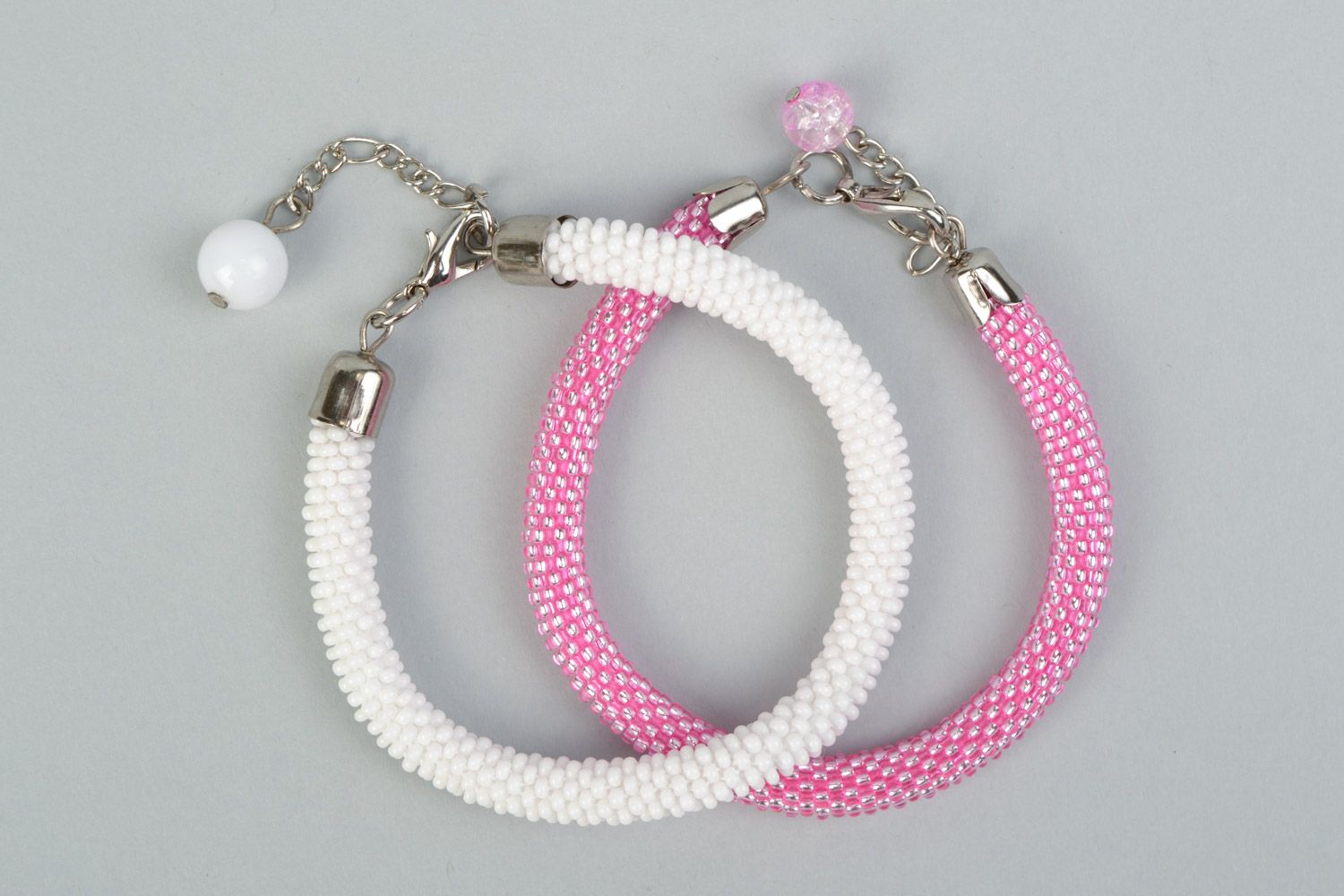 Set of 2 handmade beaded cord women's wrist bracelets in pink and white colors photo 2