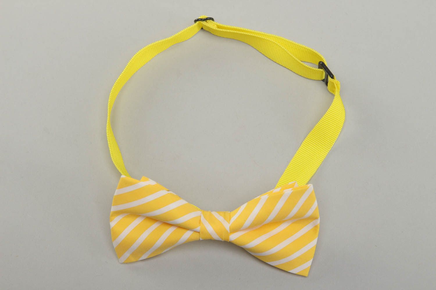 Lemon-colored fabric bow tie with stripes photo 1