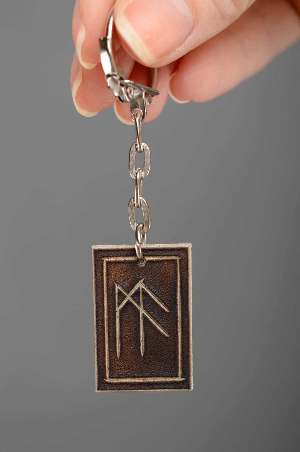 Handmade leather keychain with runes photo 2