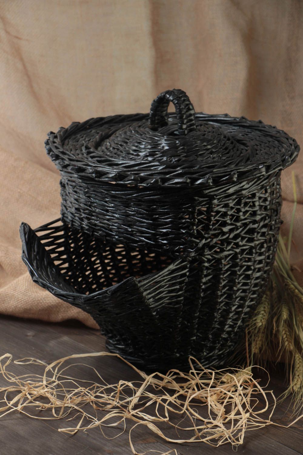 Handmade black decorative basket with lid woven of paper tubes of unusual shape photo 1