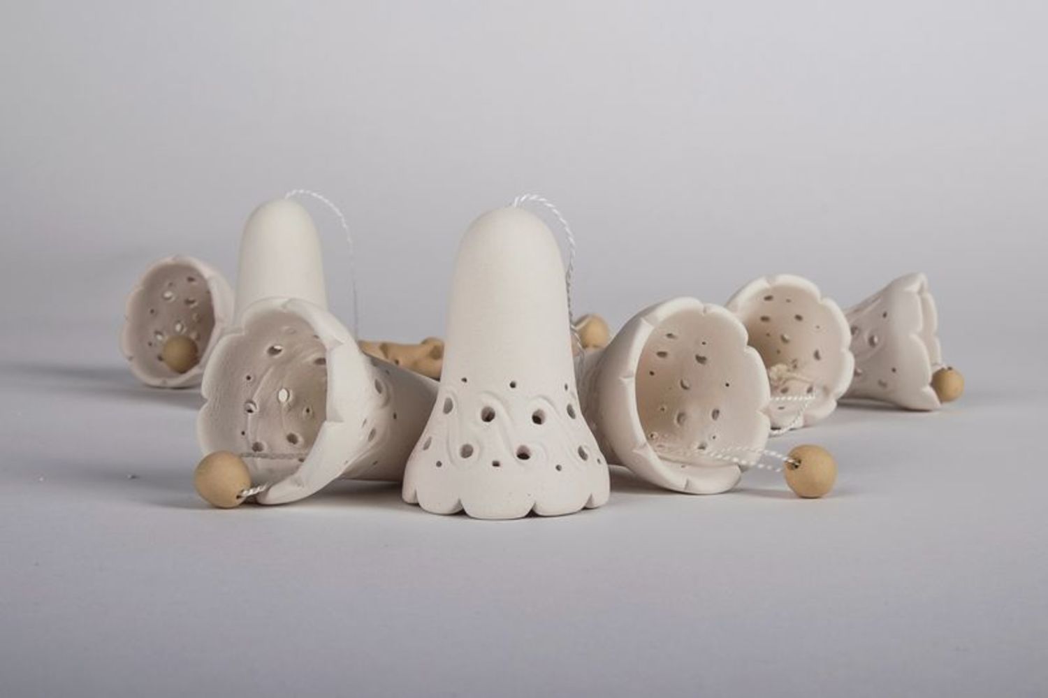 White and brown ceramic bells  photo 5