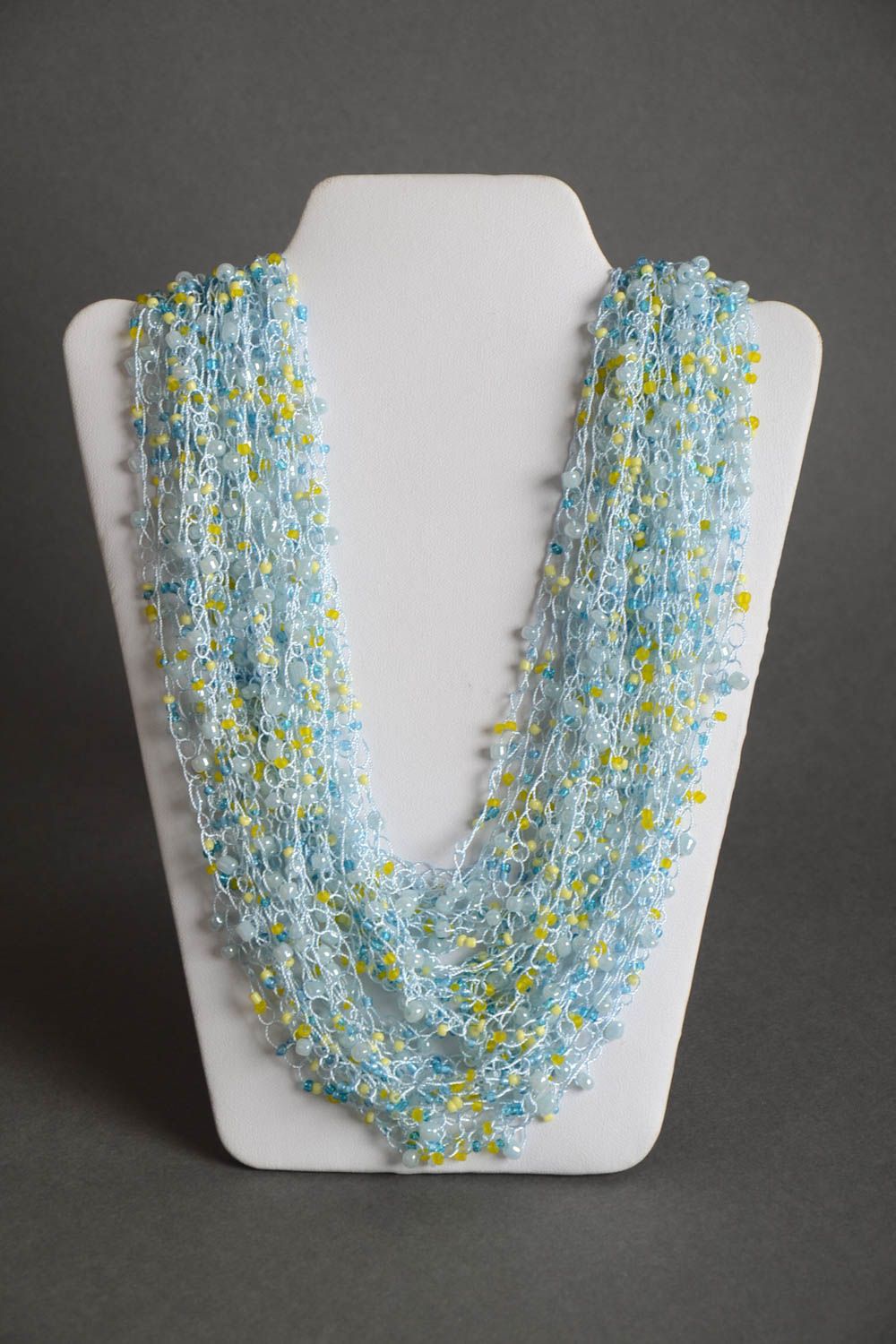 Handmade multi row airy necklace crocheted of beads in light blue color shades photo 2