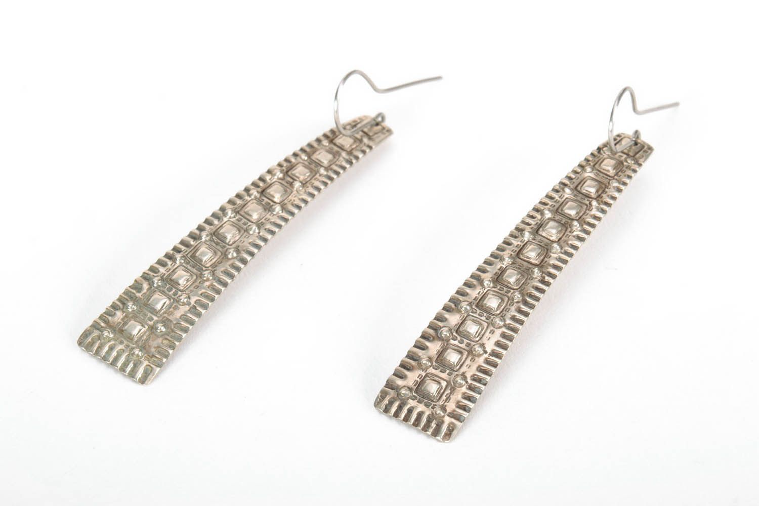 Long metal earrings with ornament photo 1