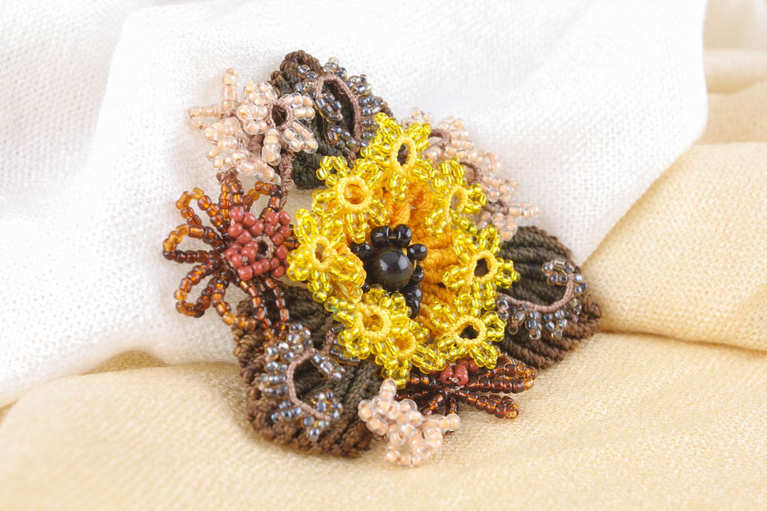 Beaded brooch made of threads photo 1