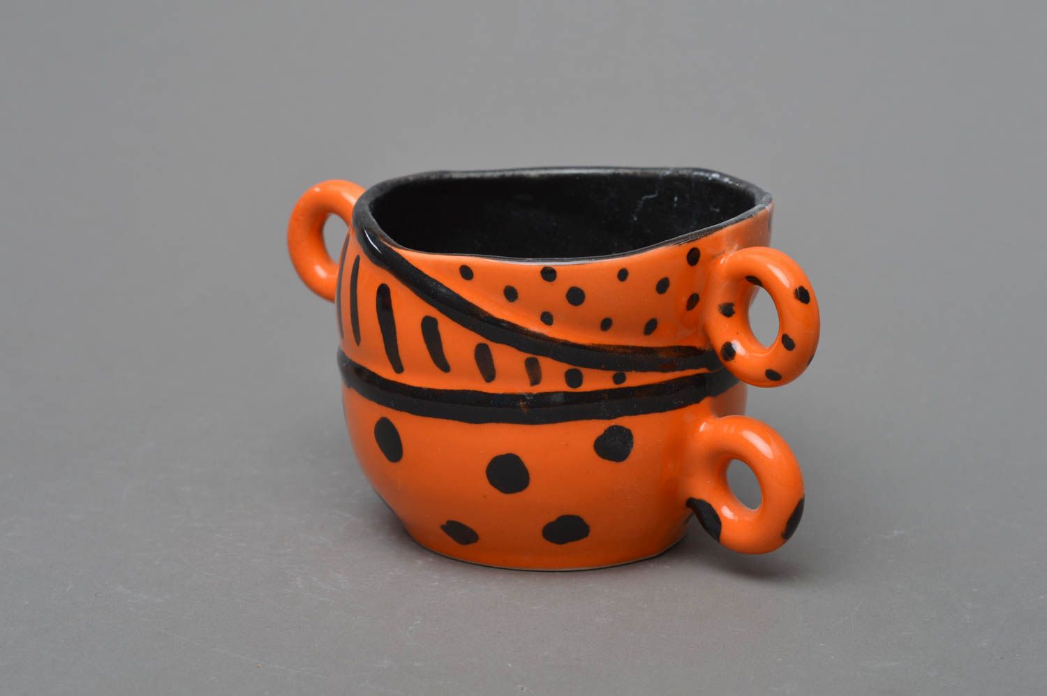 Clay orange and black glazed coffee cup with three handles and black glaze inside photo 2