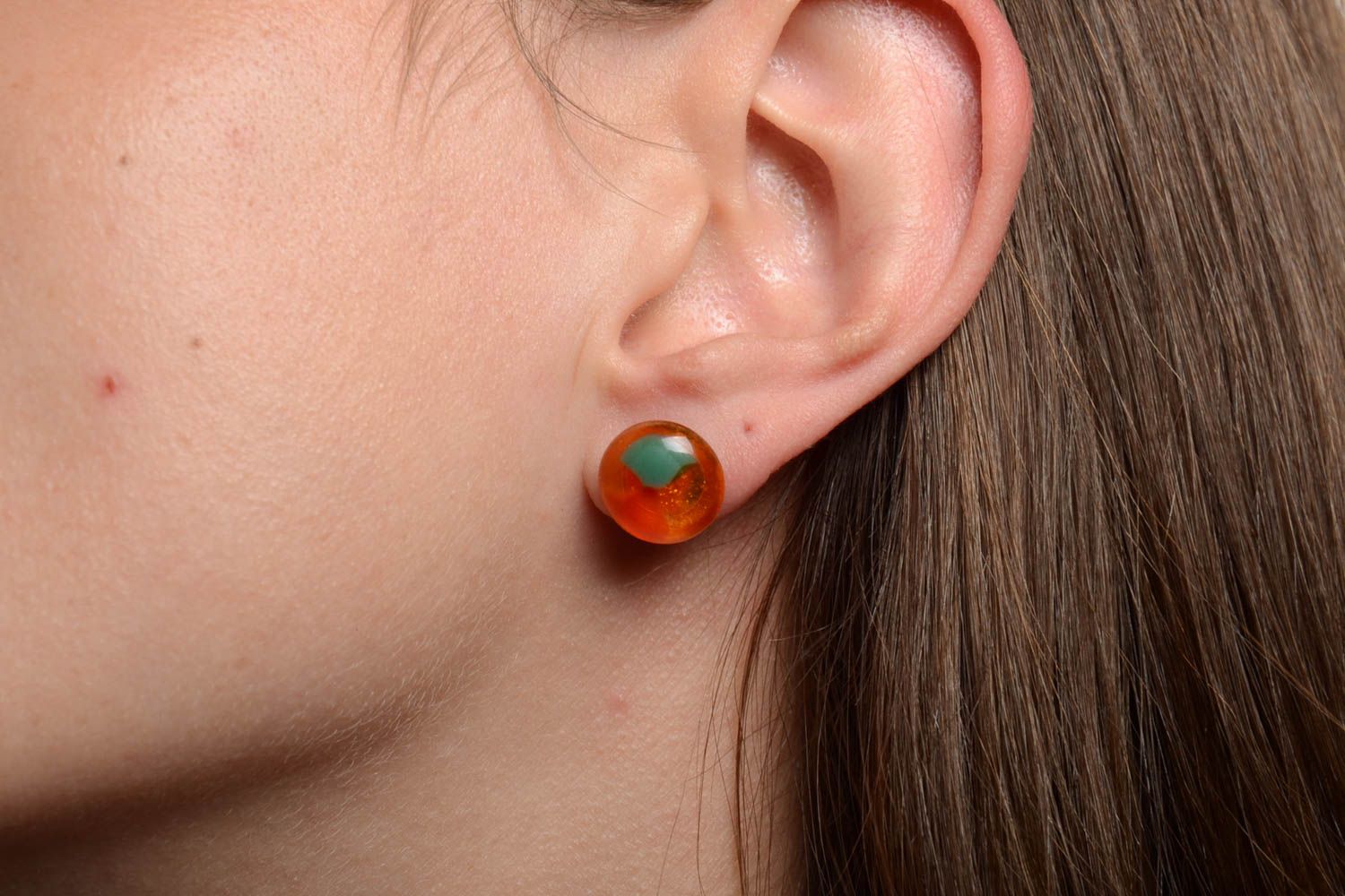 Handmade transparent orange stud earrings made using glass fusing technique photo 2