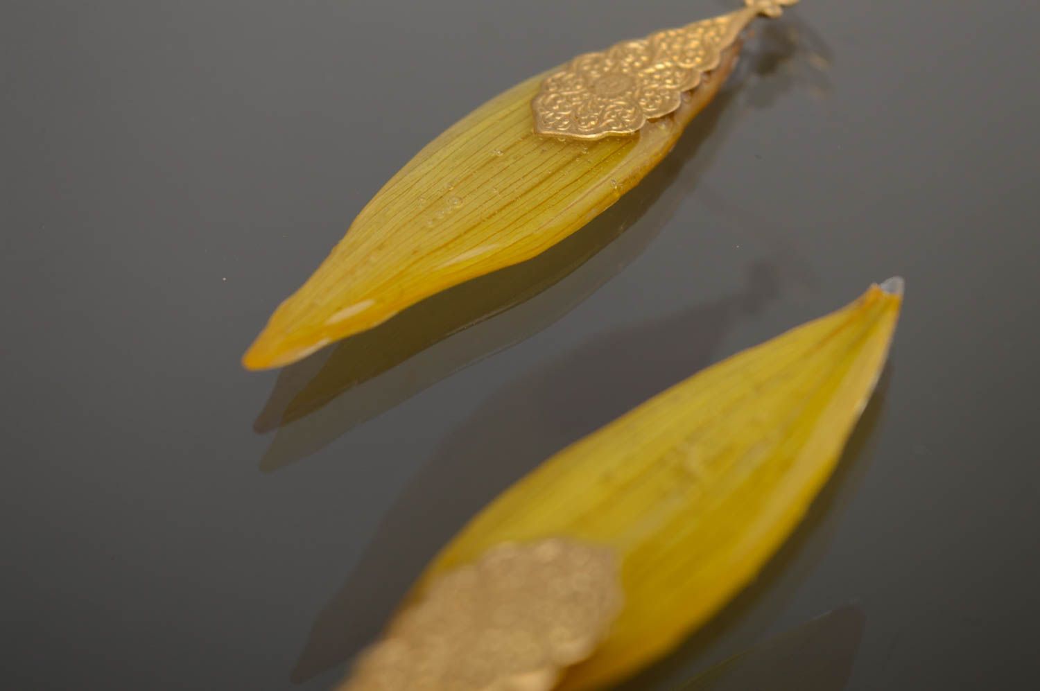 Epoxy long earrings with natural sunflower petals photo 5