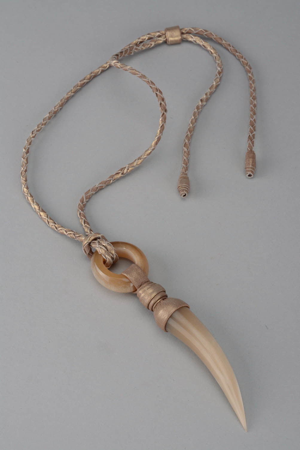 Pendant made of polished cow horn photo 1