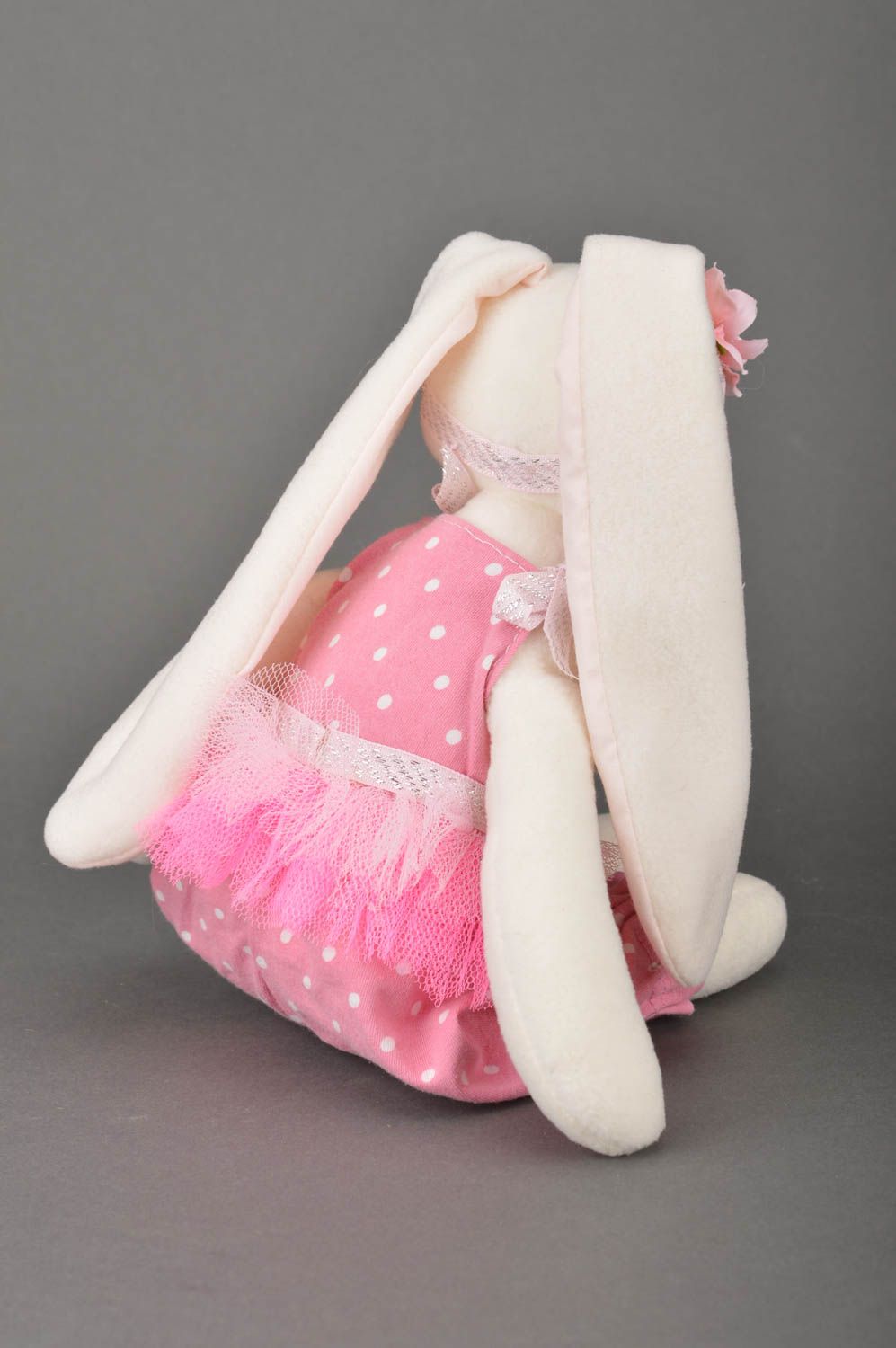 Handmade soft toy sewn of cotton fabric rabbit in pink clothing for children photo 5