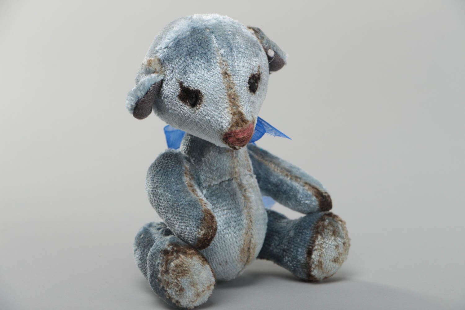 Handmade decorative gray toy bear with small bow interior decor element photo 2