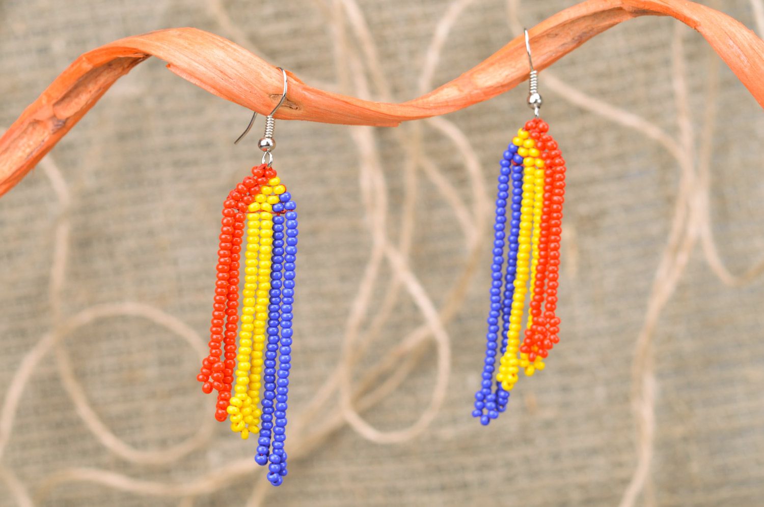 Handmade long bright beaded dangle earrings in yellow blue and red colors  photo 1