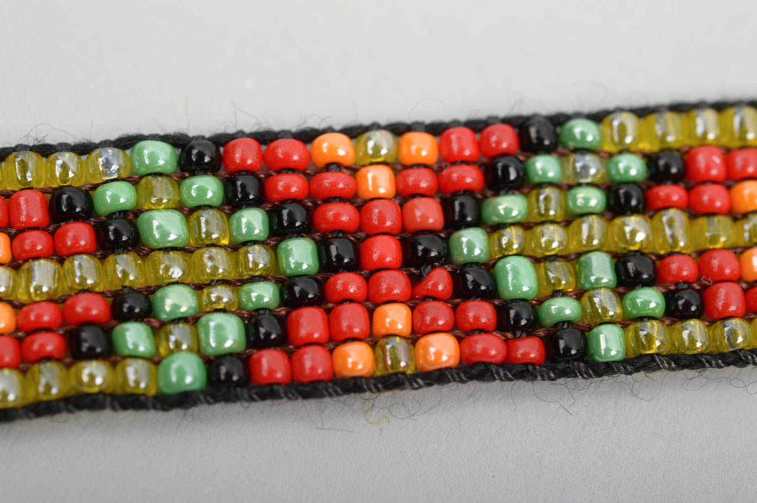 Handmade beaded strand bracelet with green, red, black beads for women photo 6