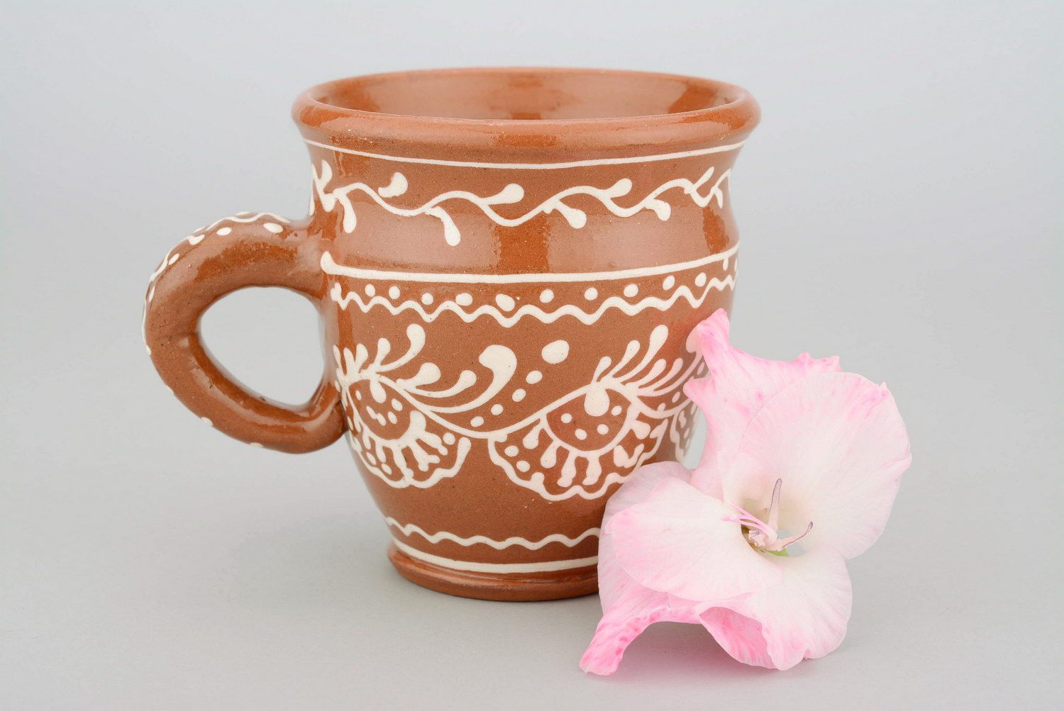 Glazed clay tea cup in terracotta color with eco pattern in white color photo 4