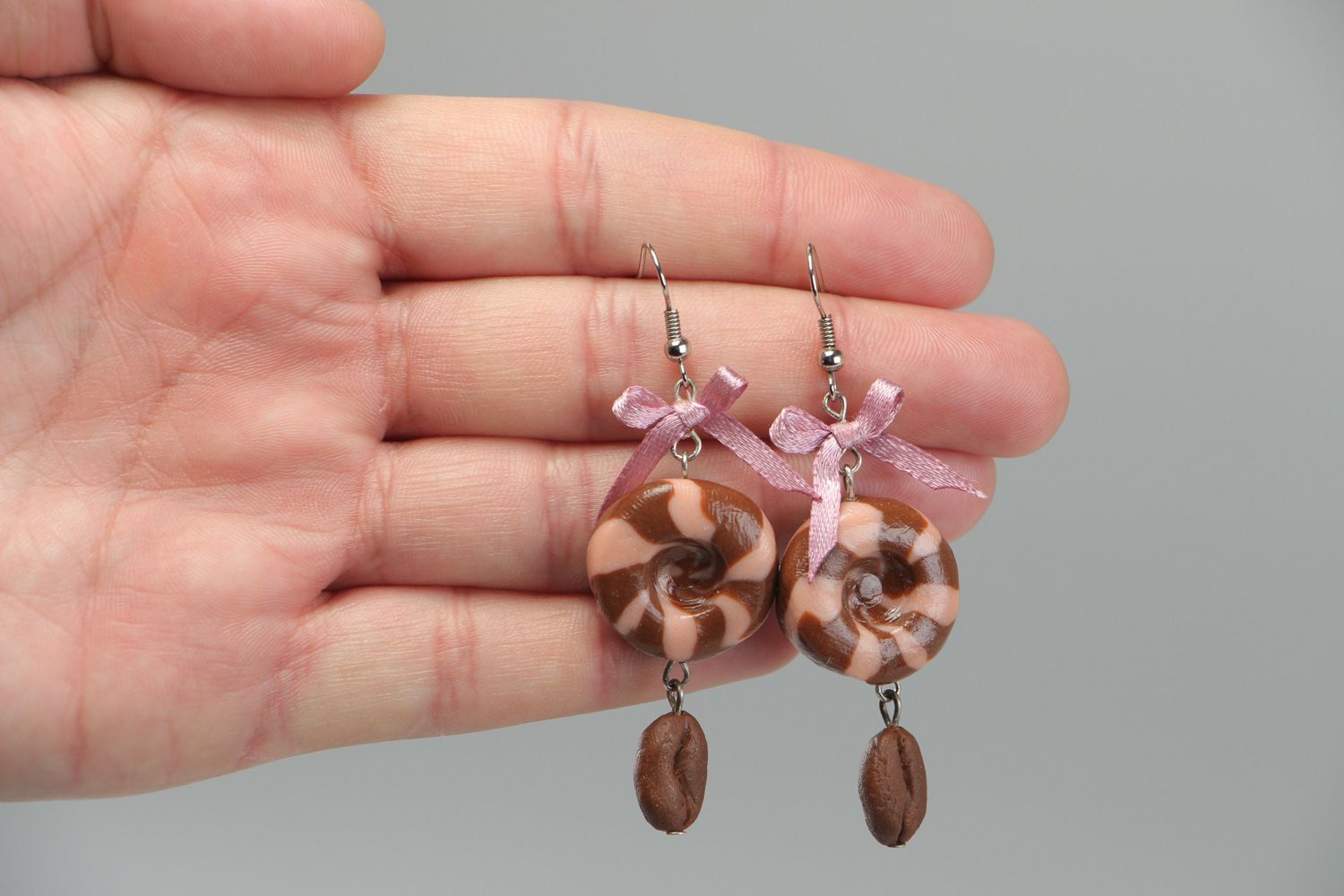 Handmade round dangle earrings made of plastic with satin bows in brown color photo 3