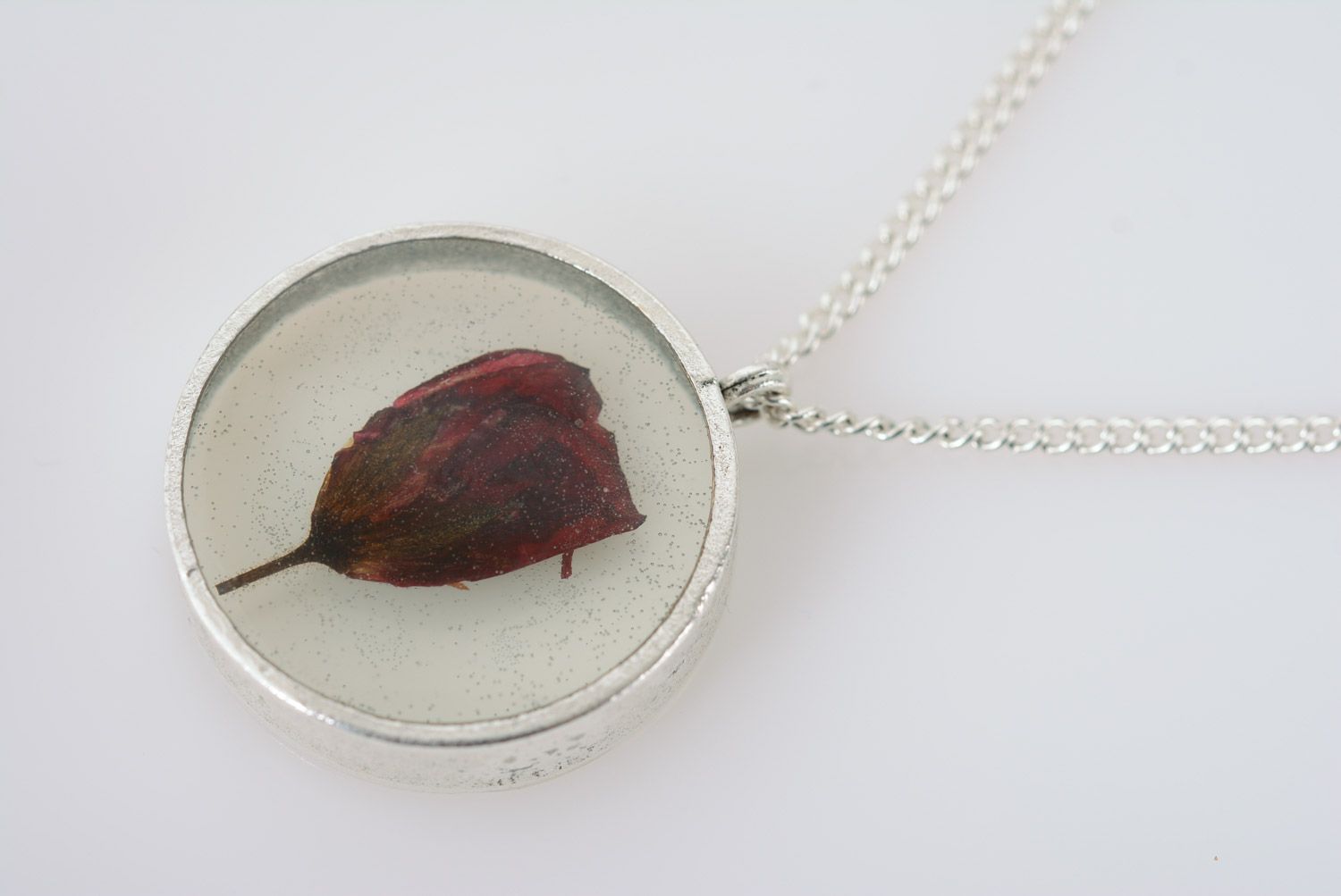 Handmade small transparent pendant with dark red flower in epoxy resin on chain photo 5