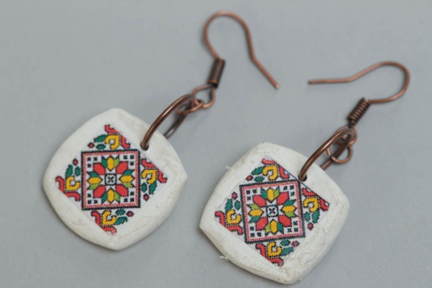 Handmade designer white earrings with Ukrainian symbolism made of polymer clay photo 2
